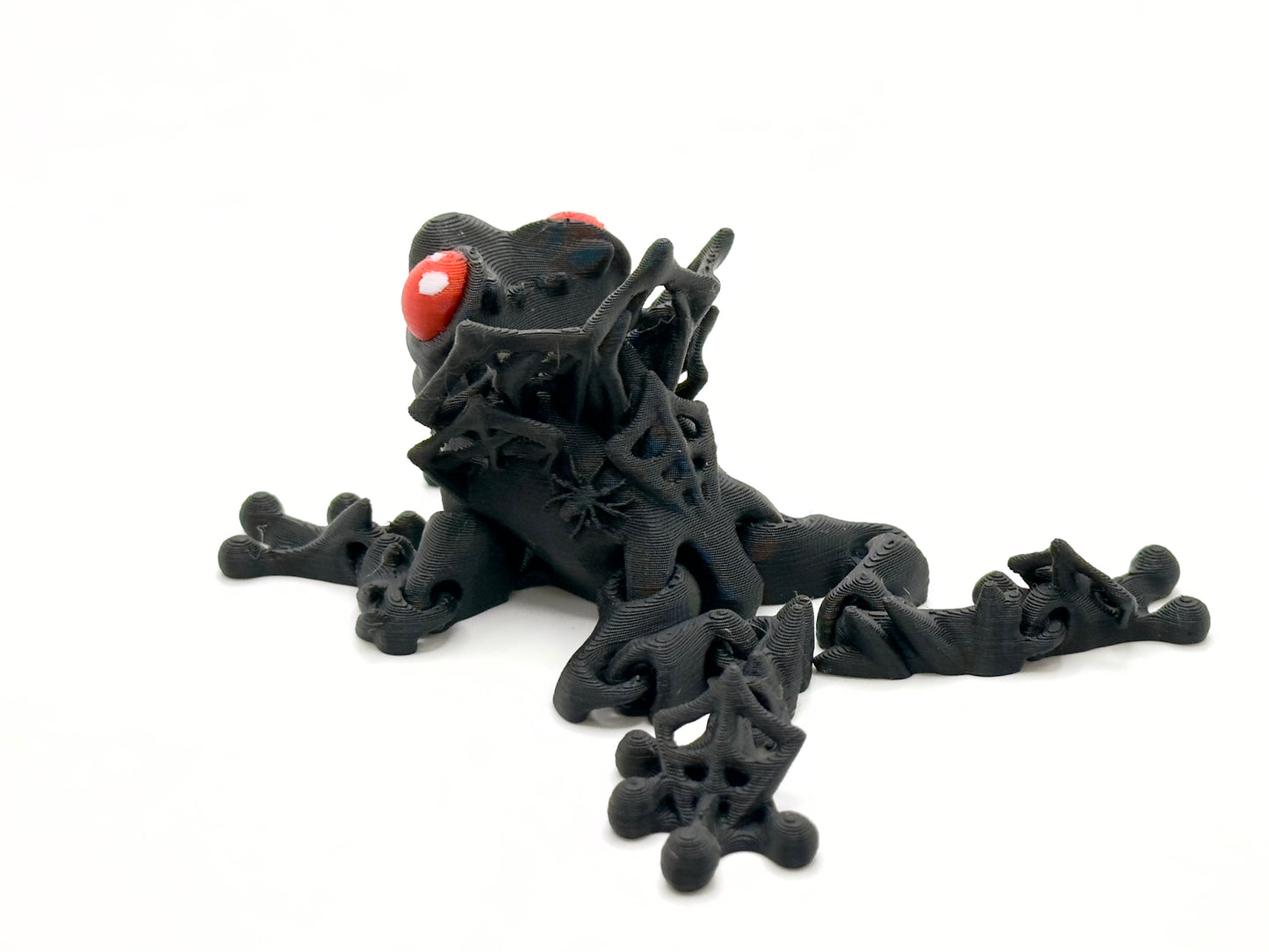 Count Frogula black with red eyes rear. Count Frogula is a frog with the teeth and "collar" of a vampire